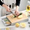 Imagen de Tabla de cocina en bambú con depósito