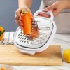 Imagen de Rallador cortador de vegetales con recipiente de conservación
